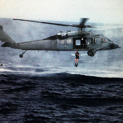 Conrad serving as a United States Navy Search and Rescue swimmer